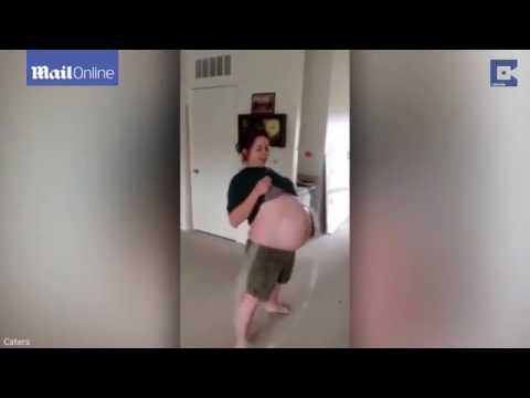 بالفيديو امرأة حامل تمارس الهيلا هوب ببطنها