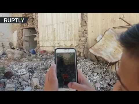 اطفال حلب يلعبون بوكيمون غو بين اطلال الحرب