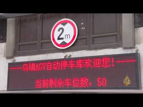 بالفيديو  روبوت صيني جديد يستخدم لركن السيارات