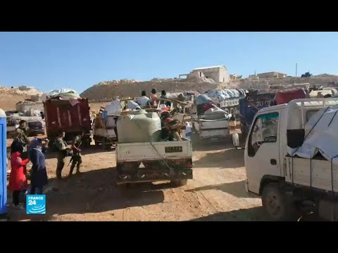 شاهد لاجئون في عرسال اللبنانية يعودون إلى منطقة القلمون السورية
