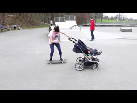 ألمانية تقفز على لوح تزلج أثناء دفع عربة ابنها الرضيع